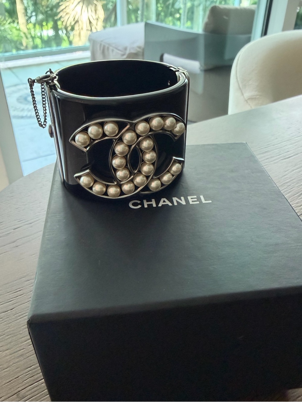 CHANEL Black Cuff Bracelet with Pearl-Studded CC Logo